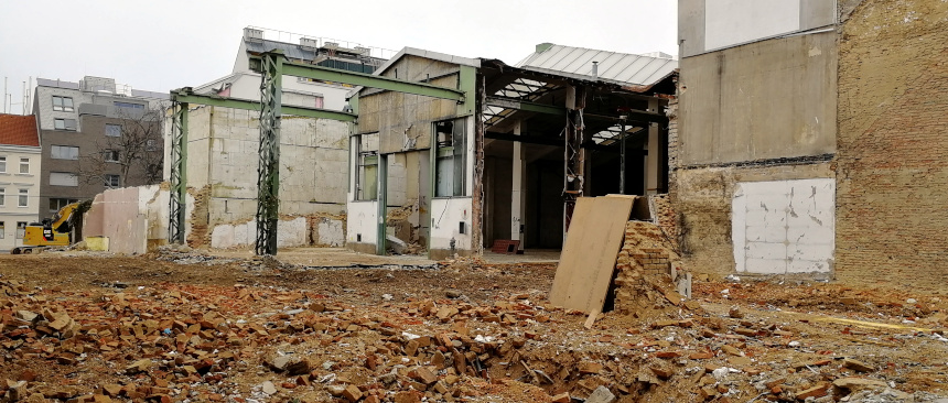 a construction site with a half-demolished building